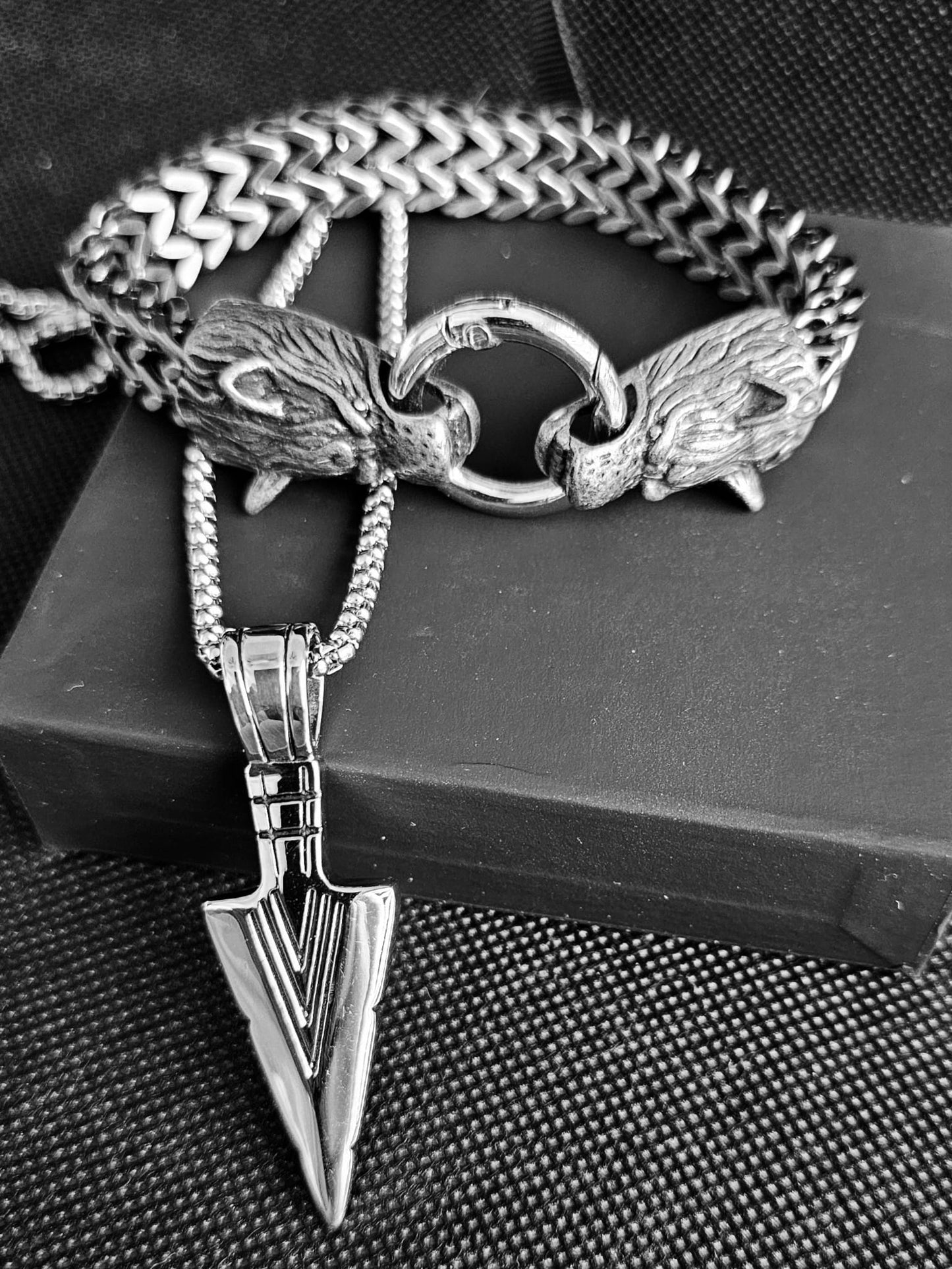 Arrow necklace and wolf bracelet.