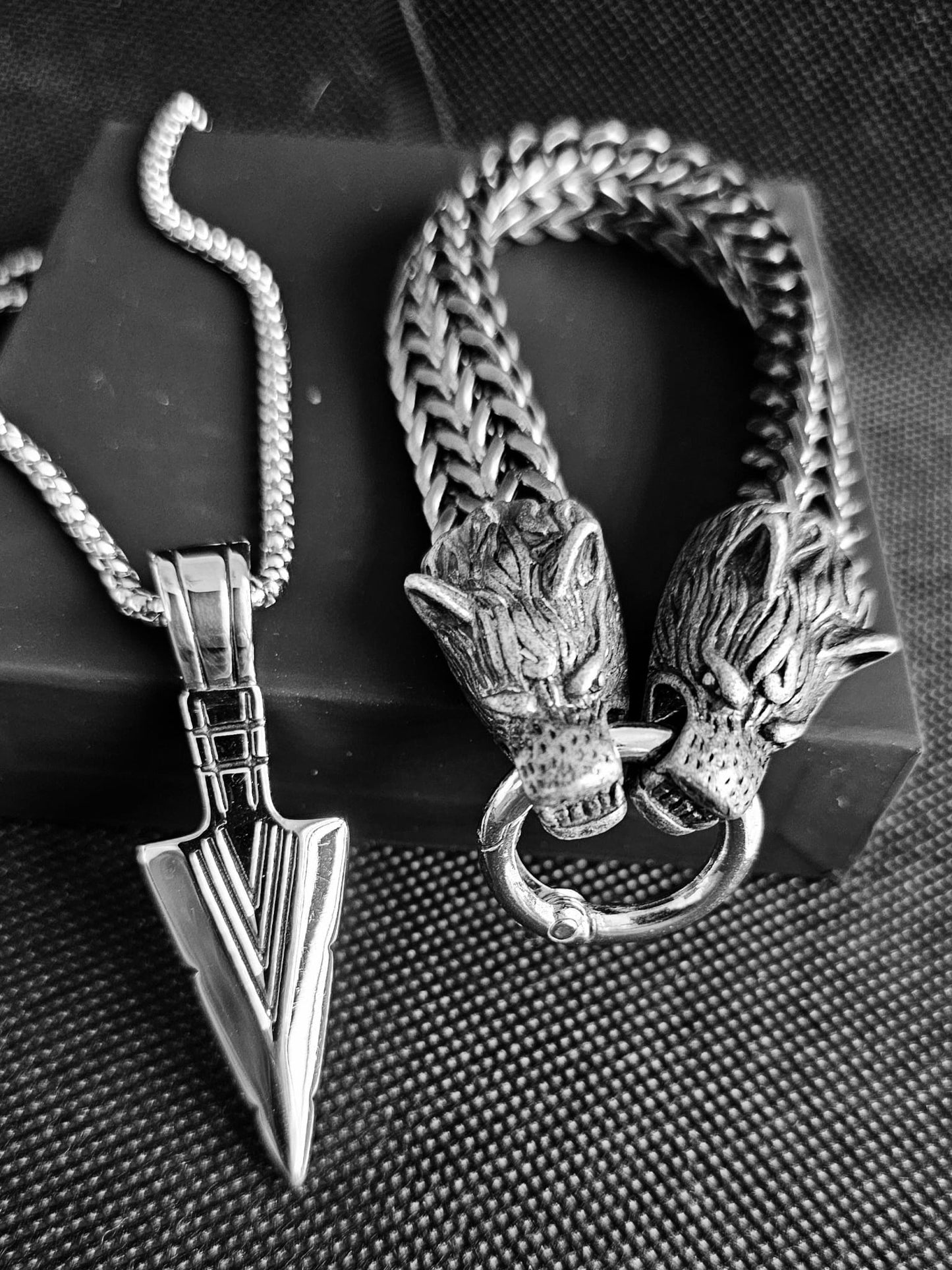 Arrow necklace and wolf bracelet.